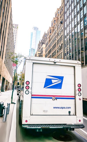 US postal truck parked on a city street