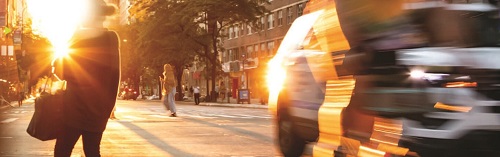 A busy city street with traffic and pedestrians