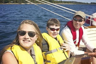 Family in Life Vests Enjoying a Boat Trip